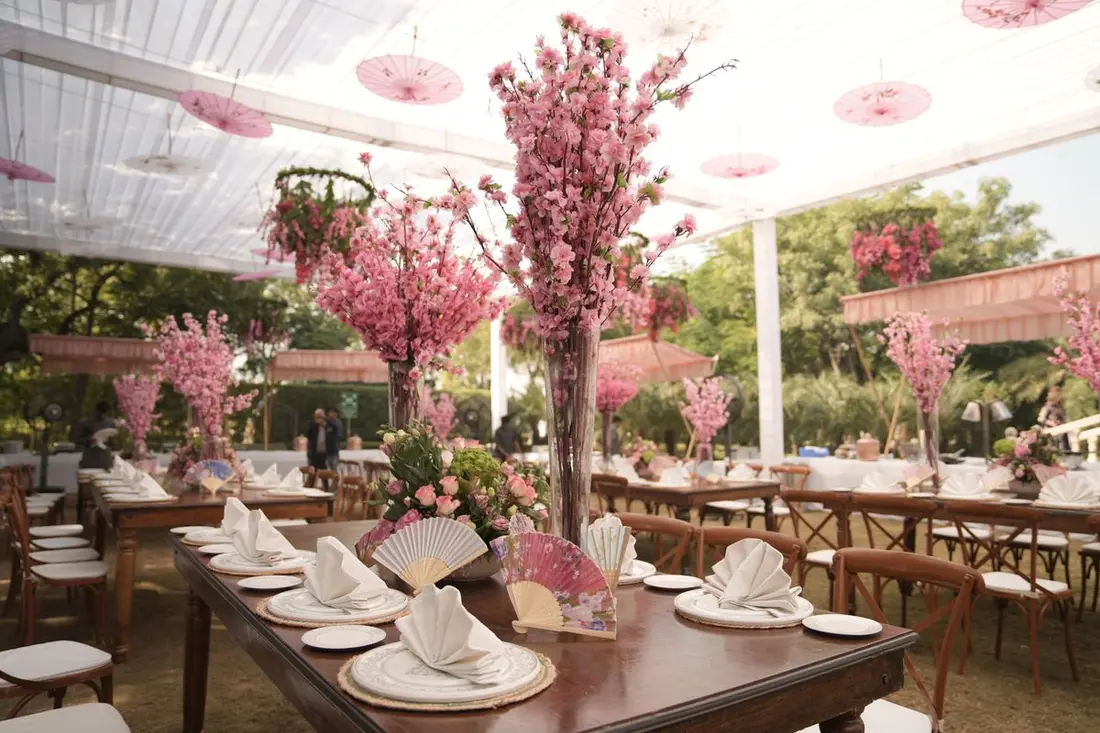 Golden lamps and flowers lighting the venue at night